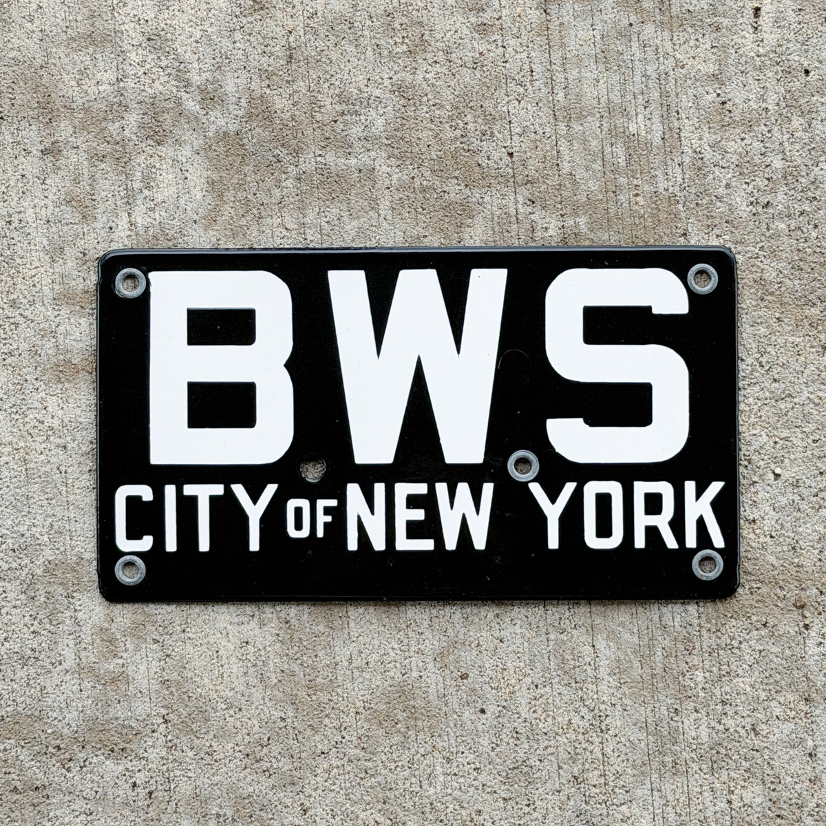 Photo of a 1920 Era New York Porcelain License Plate Auto Tag Garage Decor Vintage New York City Bureau of Water Supply BWS with original patina