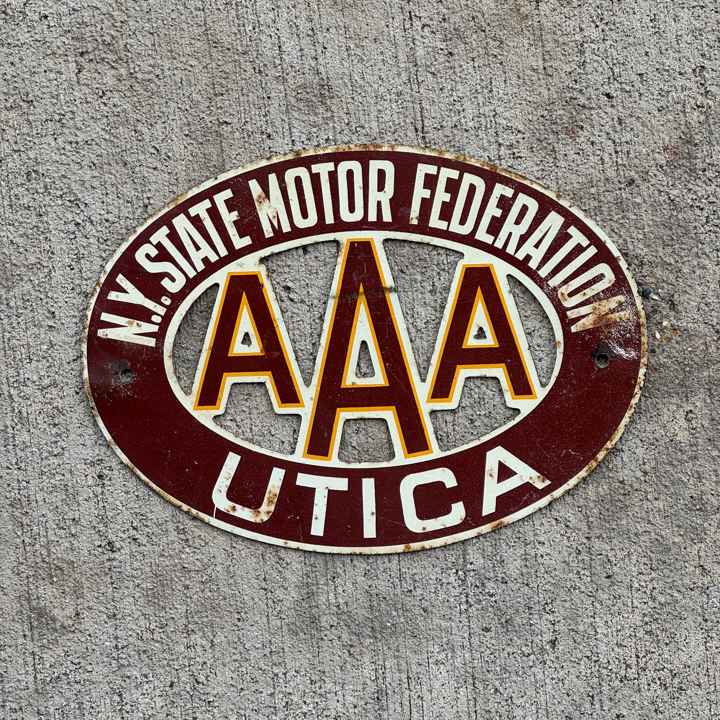 Photo of a 1920 Era Utica New York Badge Emblem License Plate Topper Auto Tag Garage Decor Vintage AAA Motor Federation with original patina
