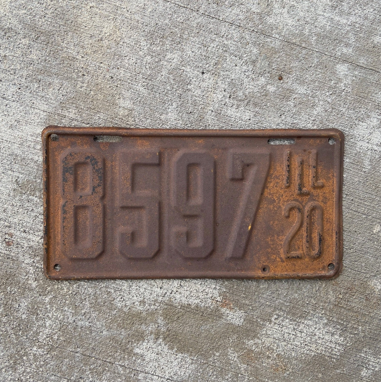 Photo of a 1920 Illinois License Plate Auto Tag Garage Decor Vintage Low Number Four Digit 8597 with original patina