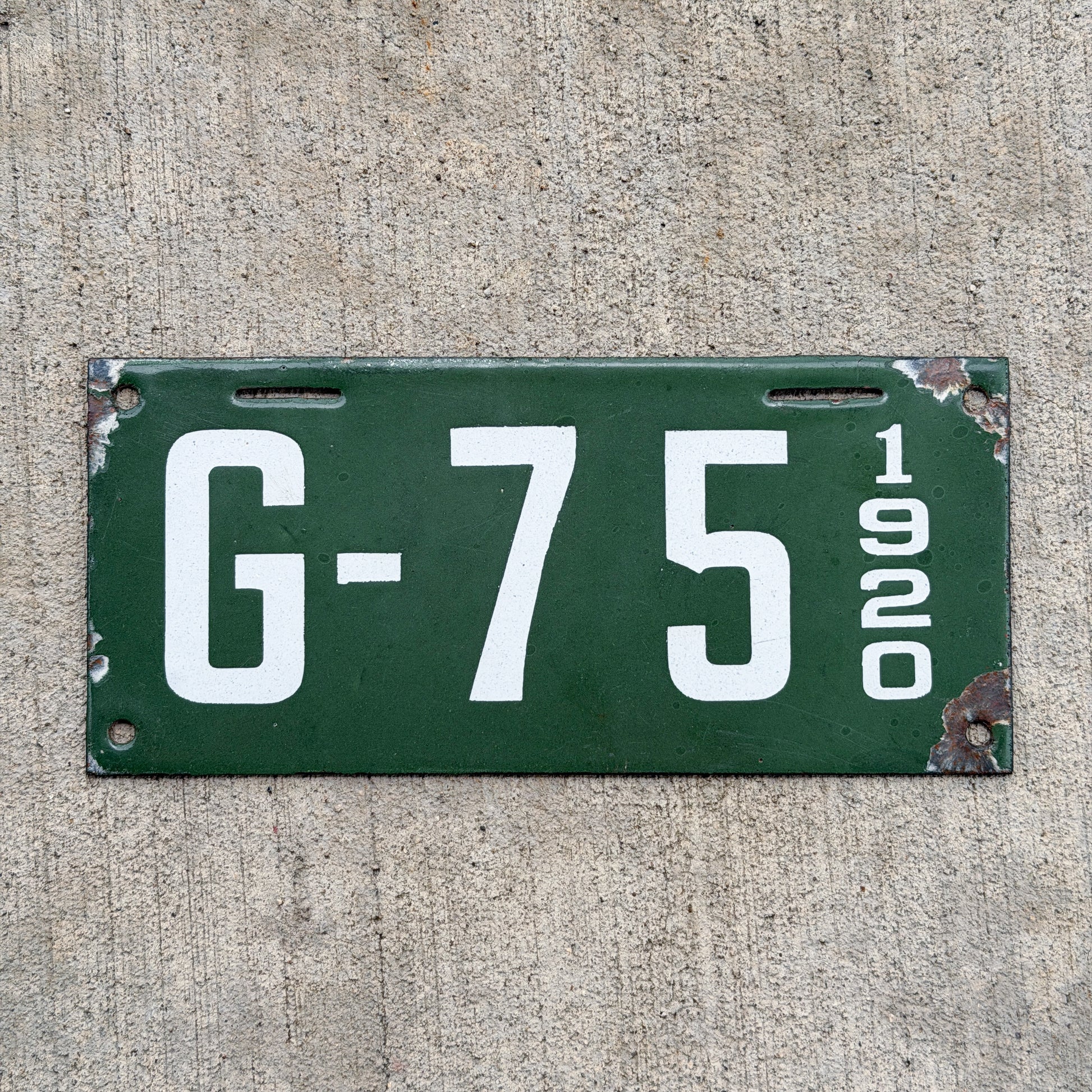 Photo of a 1920 New Hampshire Porcelain Garbage License Plate Auto Tag Garage Decor Vintage High Quality G 75 with original patina
