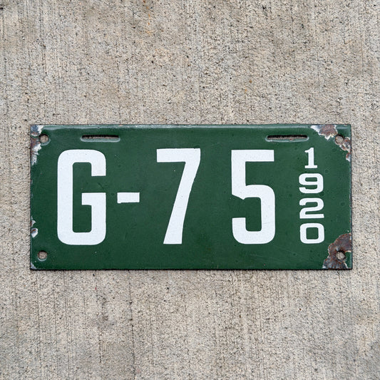 Photo of a 1920 New Hampshire Porcelain Garbage License Plate Auto Tag Garage Decor Vintage High Quality G 75 with original patina