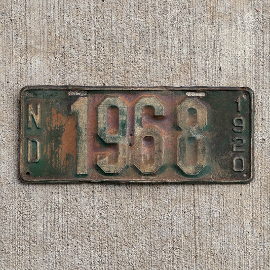 Photo of a 1920 North Dakota License Plate Auto Tag Garage Decor Vintage Four Digit Nice Number 1968 with original patina