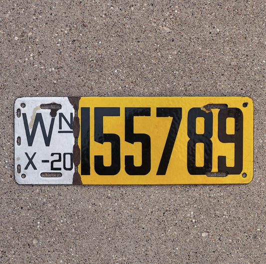 1920 Washington Porcelain License plate number 155789 on a concrete background.