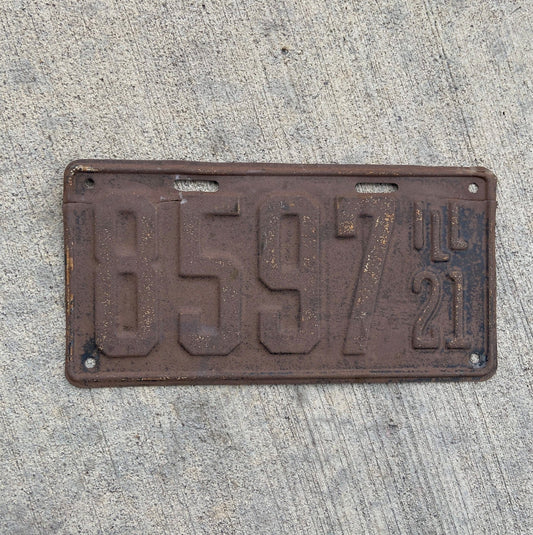 Photo of a 1921 Illinois License Plate Auto Tag Garage Decor Vintage Low Number Four Digit 8597 with original patina