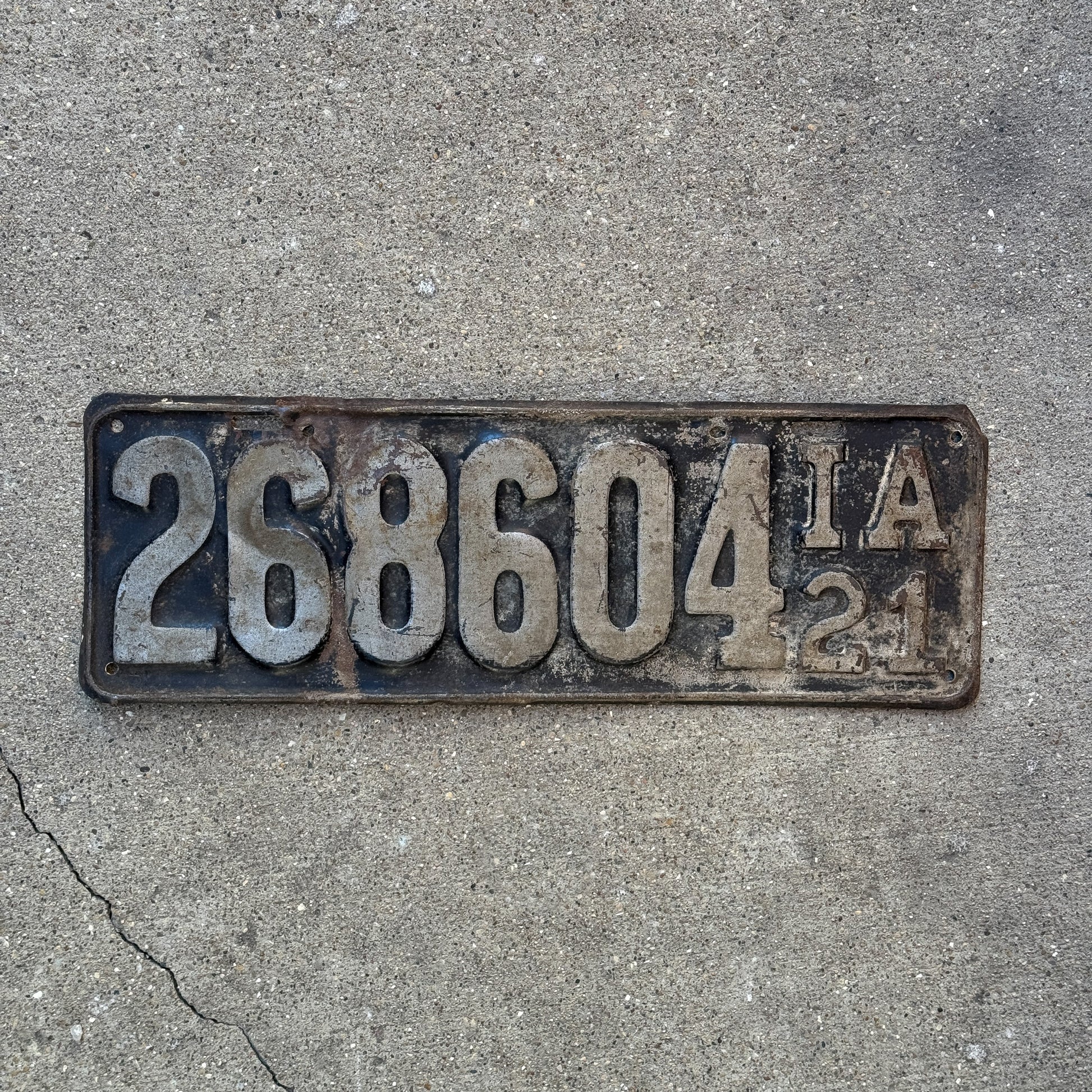Photo of a 1921 Iowa License Plate Auto Tag Garage Decor Vintage 268 604 with original patina
