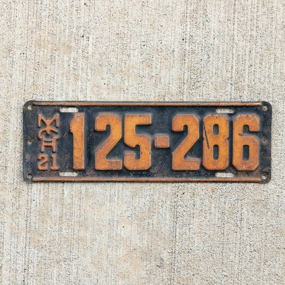 Photo of a 1921 Michigan License Plate Auto Tag Garage Decor Vintage 125 286 with original patina