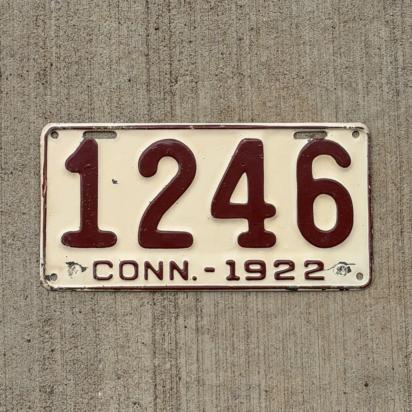 Photo of a 1922 Connecticut License Plate Auto Tag Garage Decor Vintage Low Number Four Digit 1246 with original patina