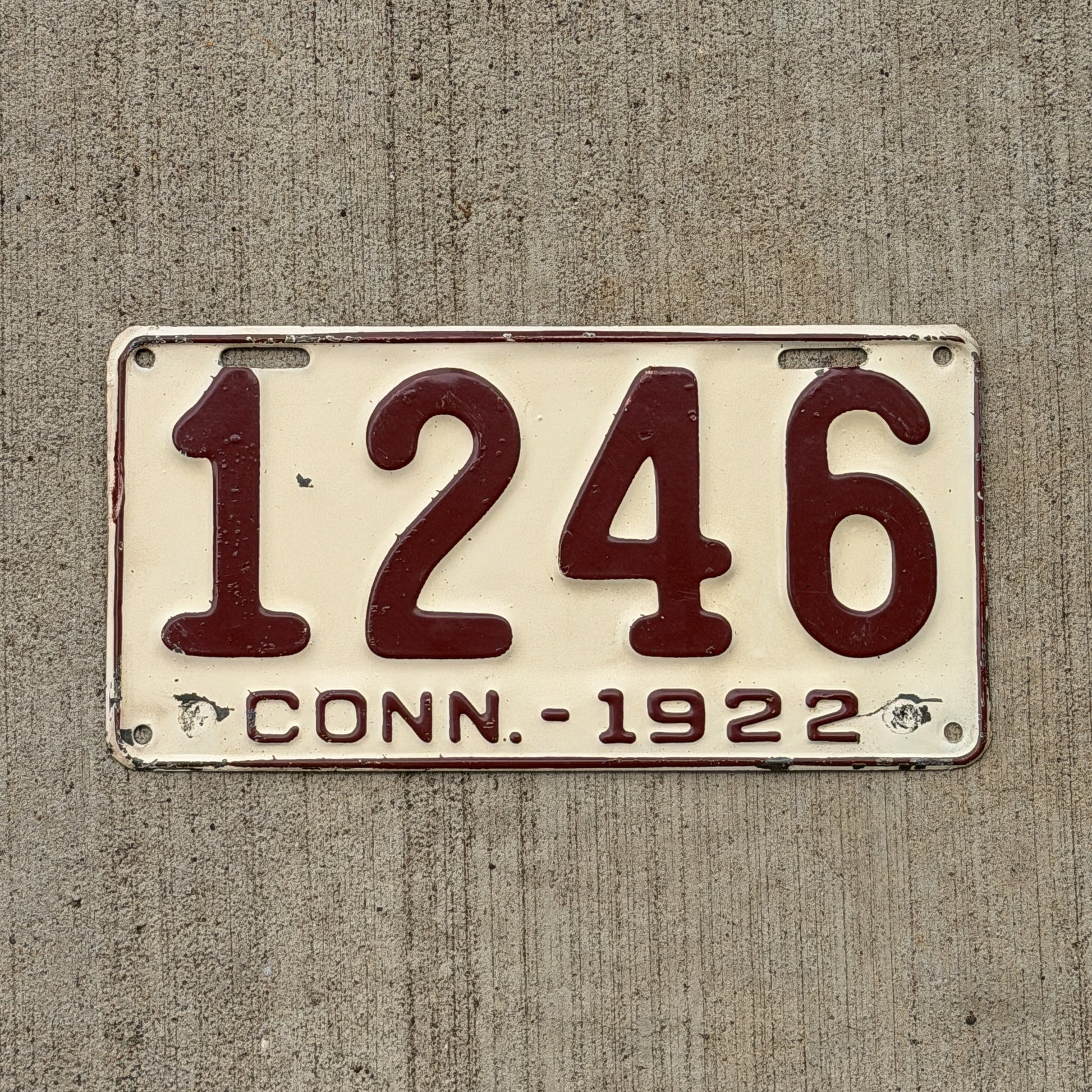 Photo of a 1922 Connecticut License Plate Auto Tag Garage Decor Vintage Low Number Four Digit 1246 with original patina