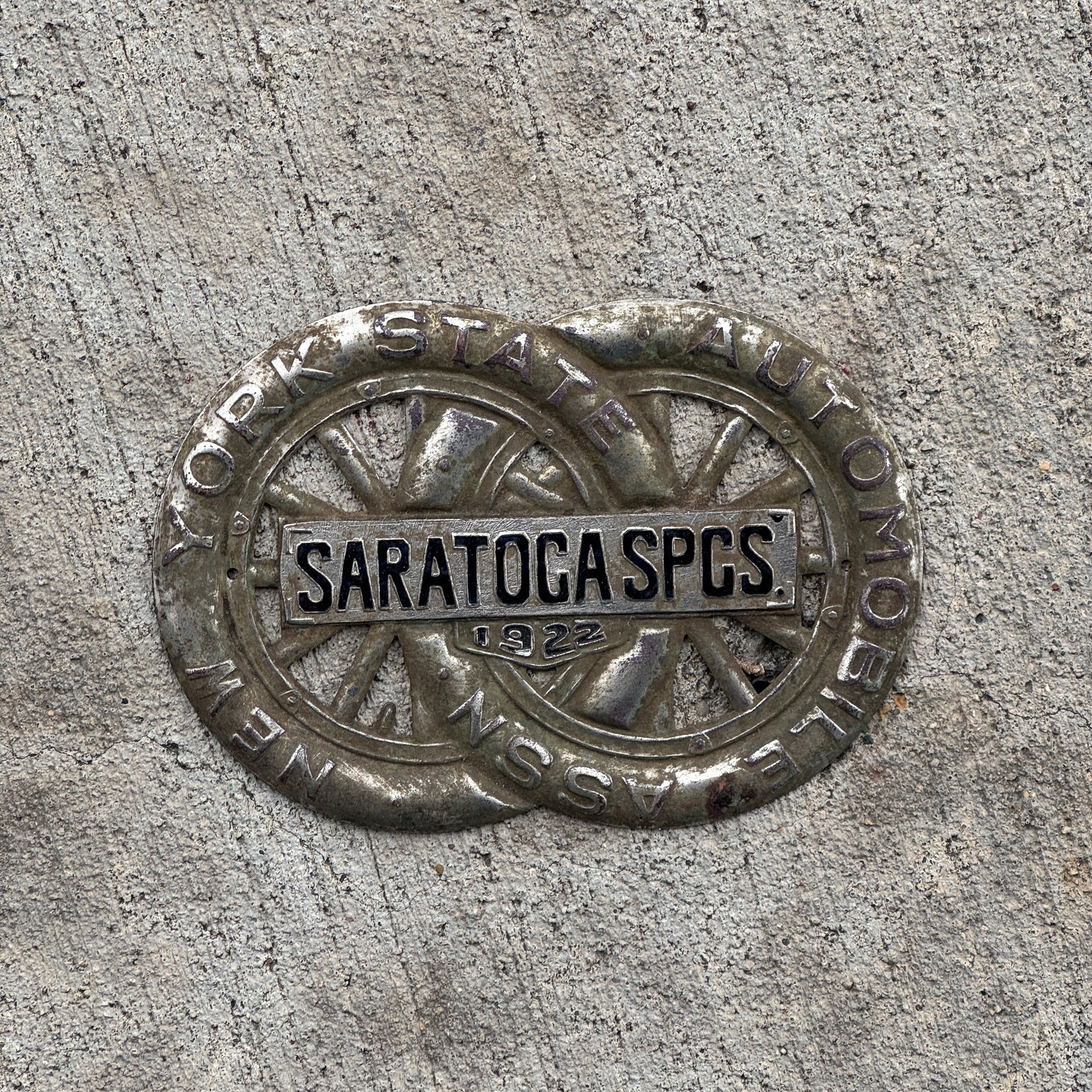 Photo of a 1922 Saratoga Springs New York Badge Emblem License Plate Topper Auto Tag Garage Decor Vintage Motor Club with original patina