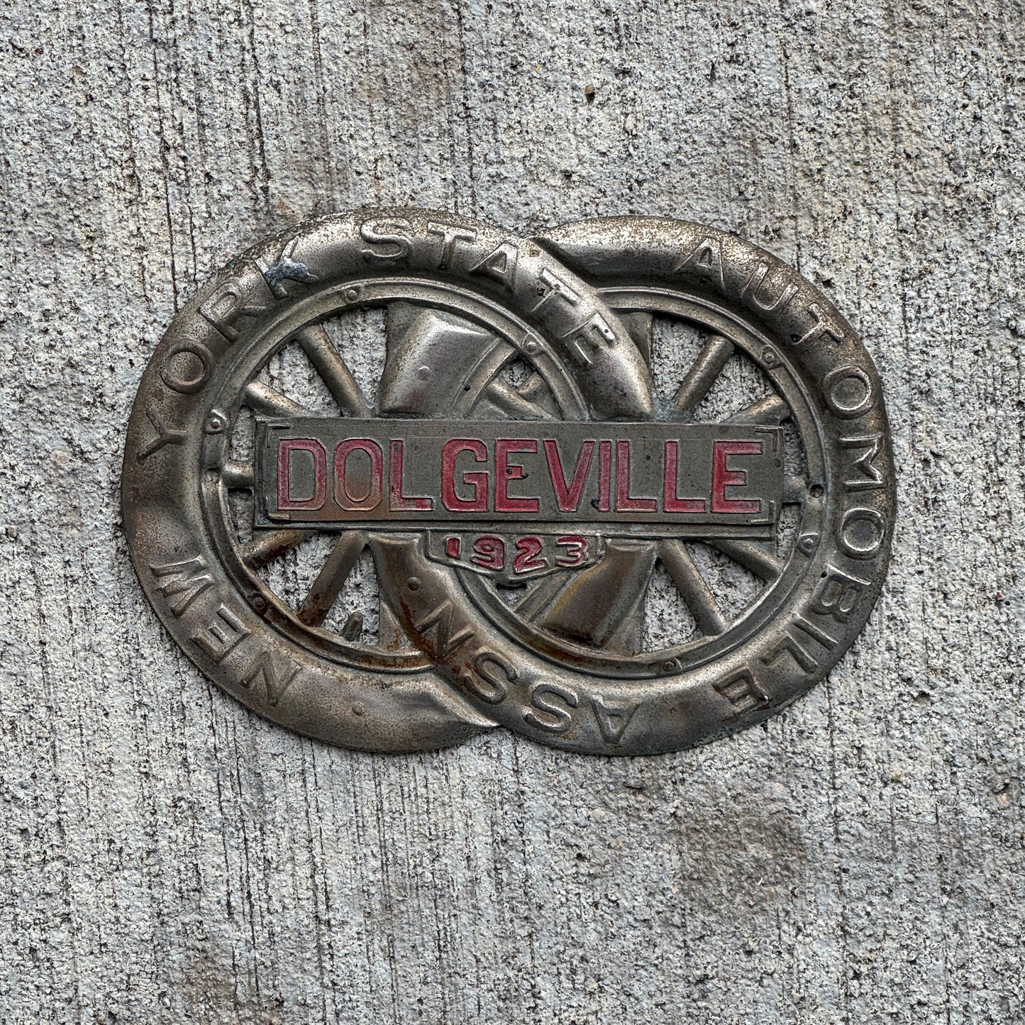 Photo of a 1923 Dolgeville New York Badge Emblem License Plate Topper Auto Tag Garage Decor Vintage Motor Club with original patina