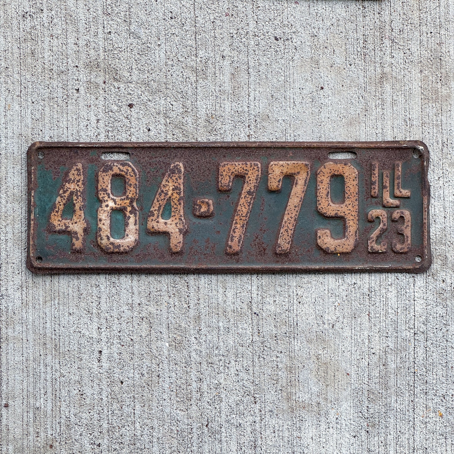 Photo of a 1923 Illinois License Plate Auto Tag Garage Decor Vintage 484 779 with original patina