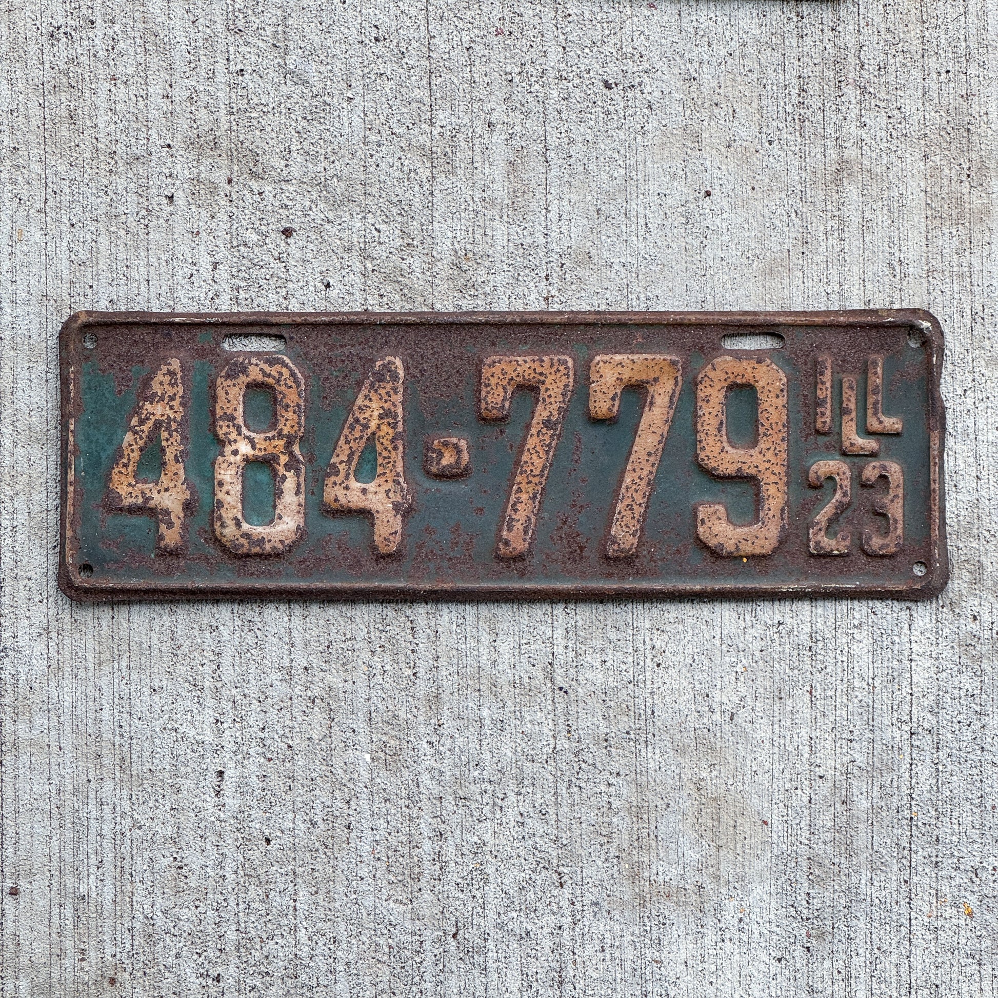 Photo of a 1923 Illinois License Plate Auto Tag Garage Decor Vintage 484 779 with original patina