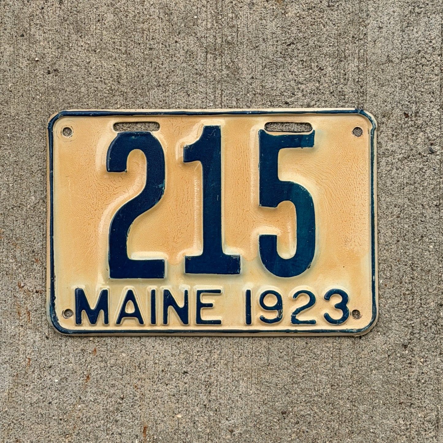 Photo of a 1923 Maine License Plate Auto Tag Garage Decor Vintage Low Number Three Digit 215 with original patina