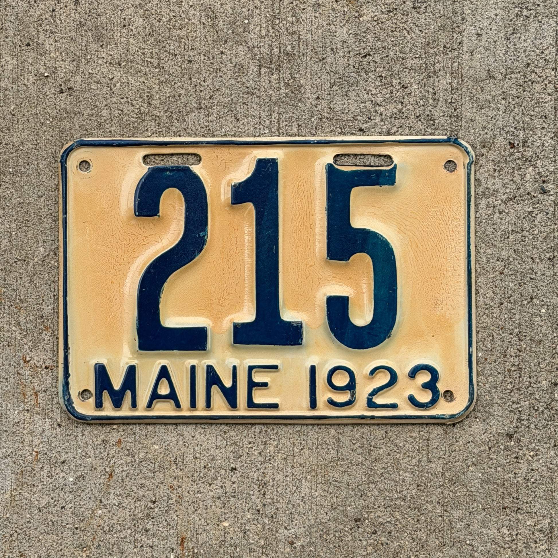 Photo of a 1923 Maine License Plate Auto Tag Garage Decor Vintage Low Number Three Digit 215 with original patina