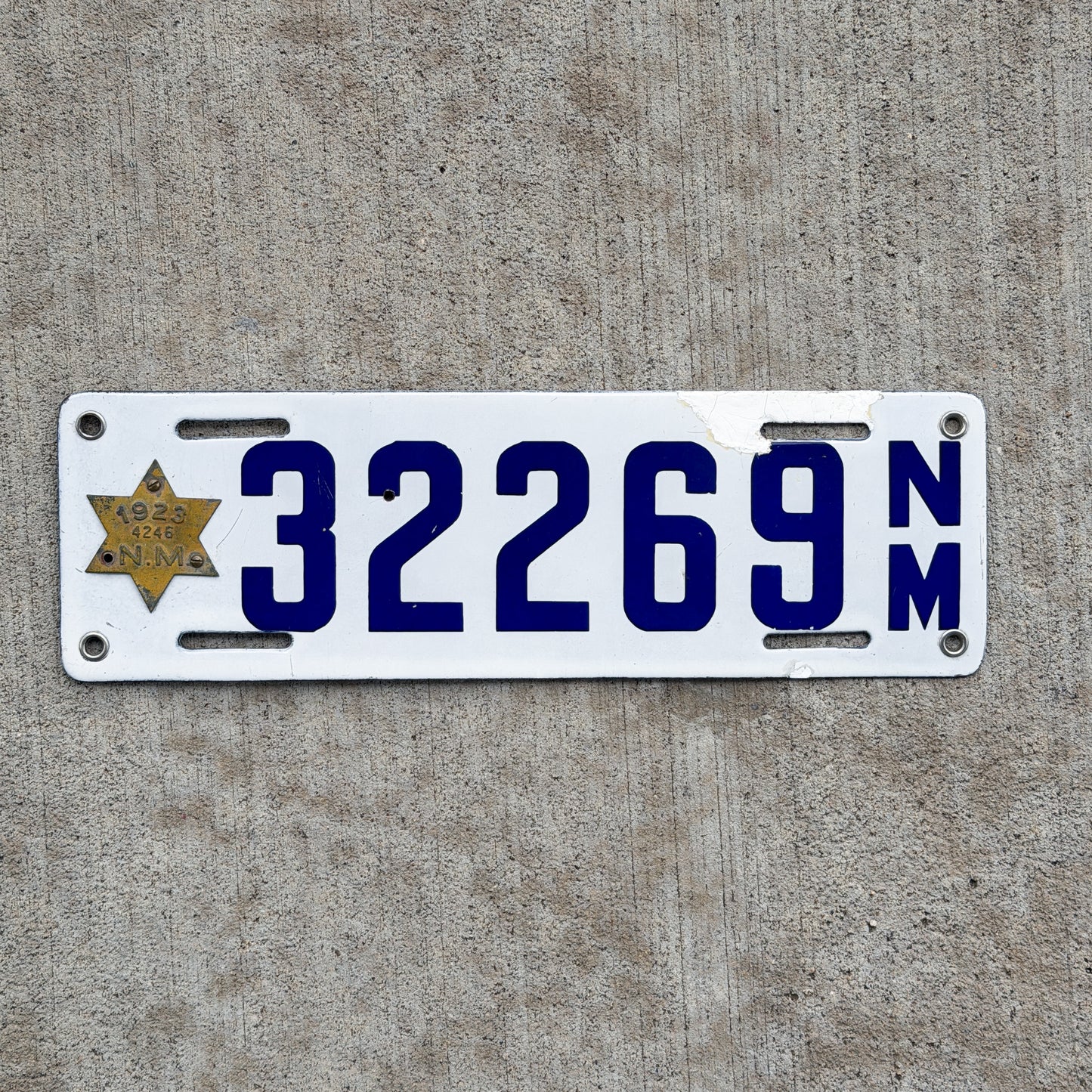 Photo of a 1923 New Mexico Porcelain License Plate Auto Tag Garage Decor Vintage Star Tab High Quality 32269 with original patina