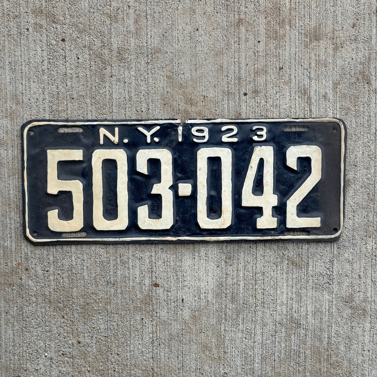 Photo of a 1923 New York License Plate Auto Tag Garage Decor Vintage 503 042 with original patina
