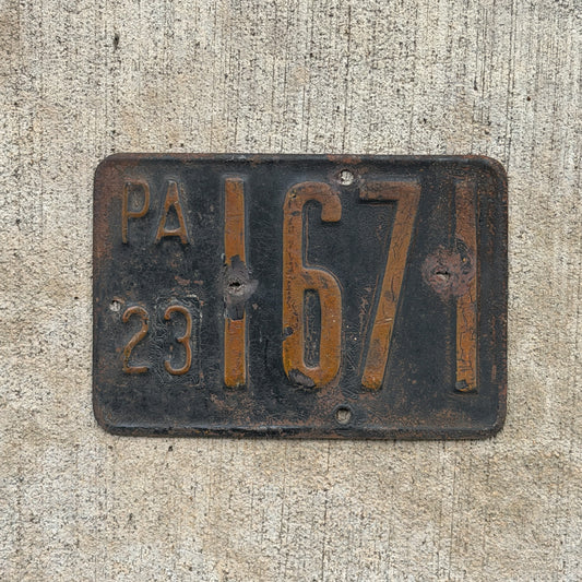 Photo of a 1923 Pennsylvania Motorcycle License Plate Auto Tag Garage Decor Vintage Mayor Low Number Four Digit 1671 with original patina