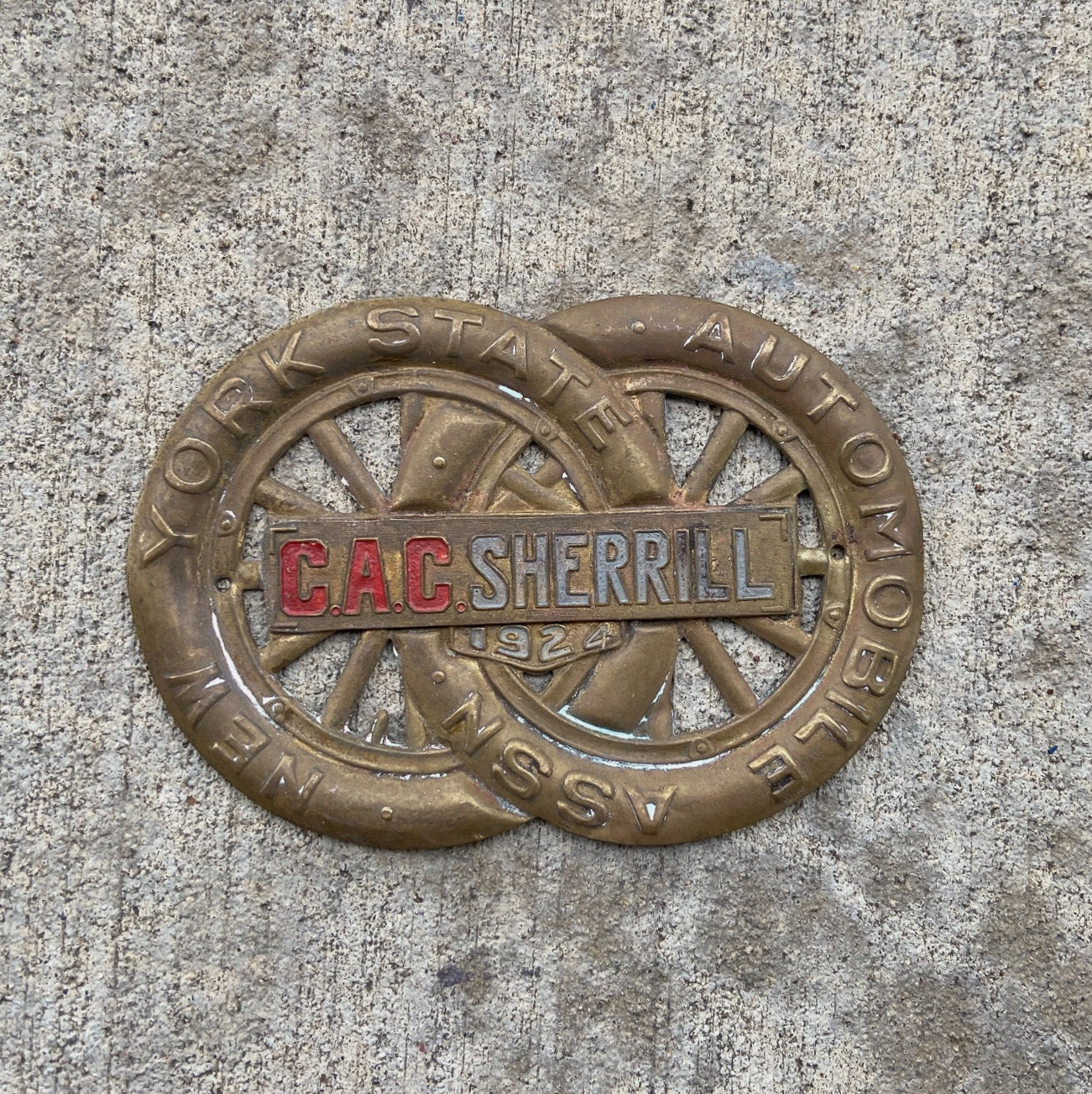 Photo of a 1924 CAC Sherrill New York License Plate Topper Auto Tag Garage Decor Vintage AAA Brass Car Badge Motor Club Automobile with original patina