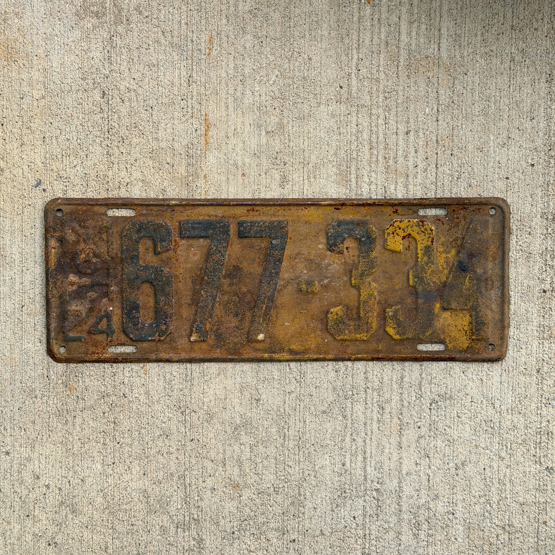 Photo of a 1924 Michigan License Plate Auto Tag Garage Decor Vintage 677 334 with original patina