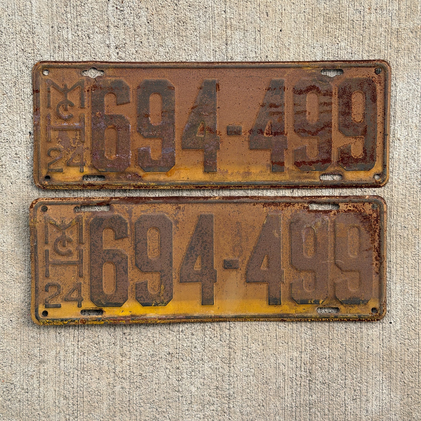 Photo of a 1924 Michigan License Plate Pair Auto Tag Garage Decor Vintage 694 499 with original patina