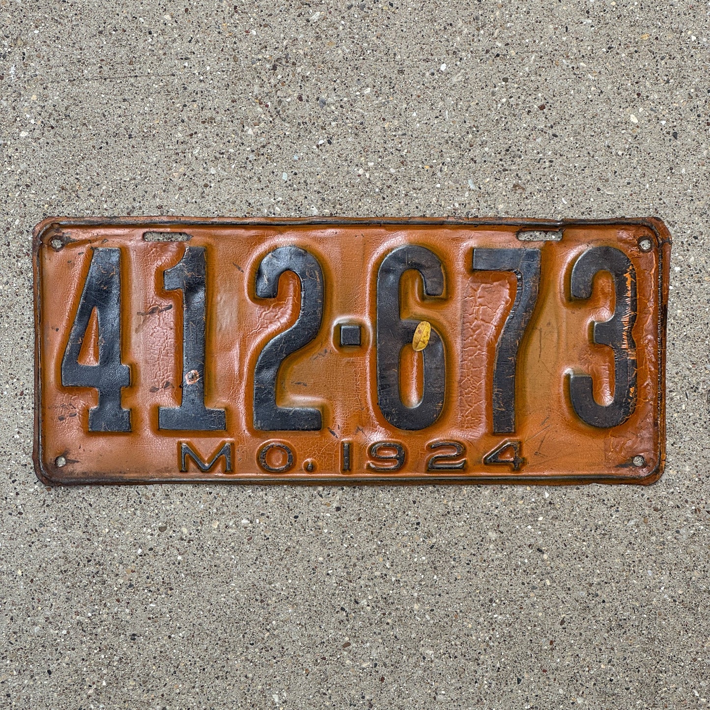 Photo of a 1924 Missouri License Plate Auto Tag Garage Decor Vintage 412 673 with original patina