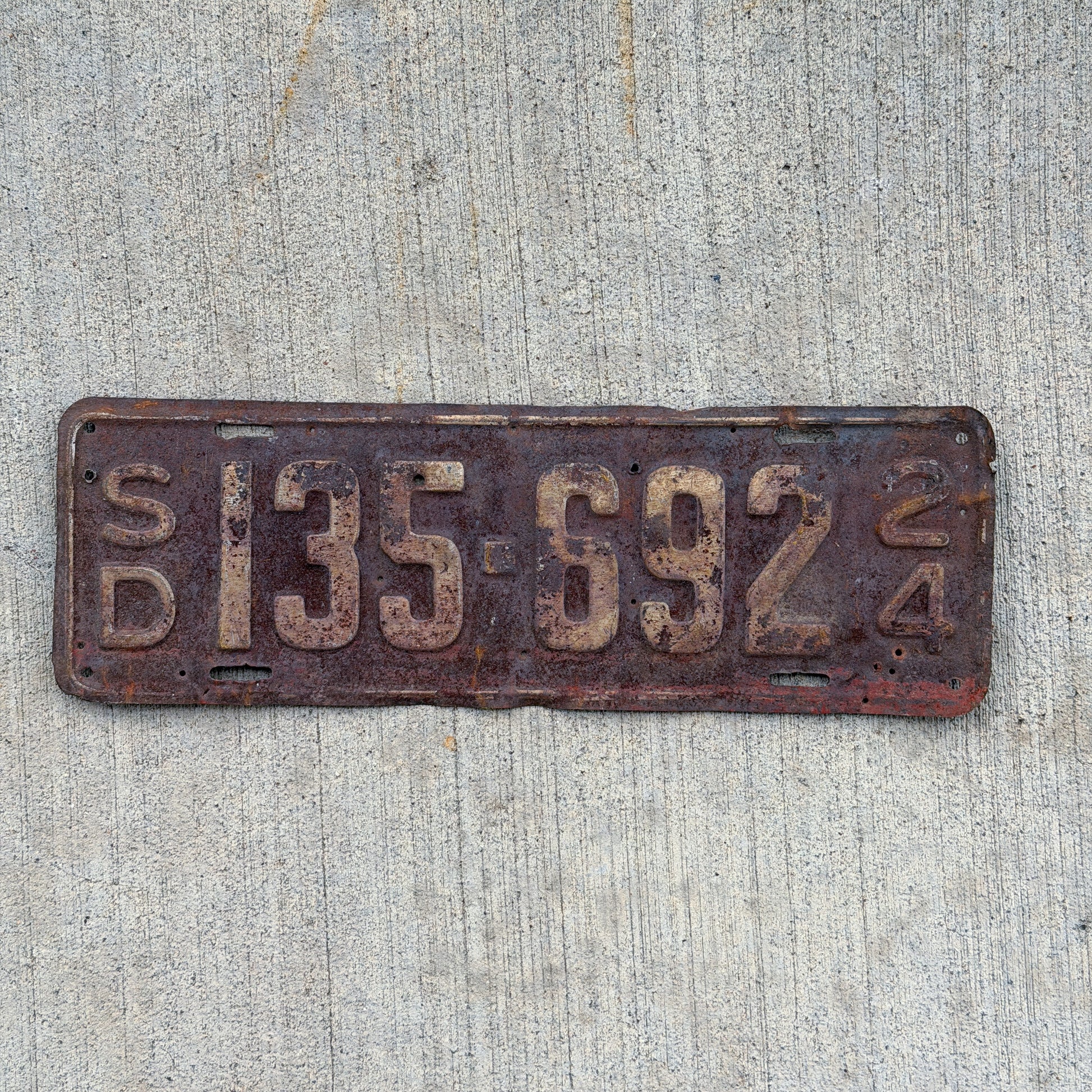 Photo of a 1924 South Dakota License Plate Auto Tag Garage Decor Vintage 135 692 with original patina