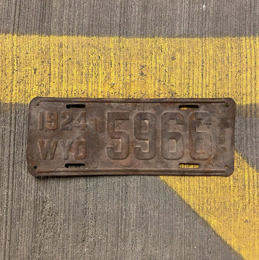 Photo of a 1924 Wyoming License Plate Auto Tag Garage Decor Vintage Low Number Four Digit 5966 with original patina