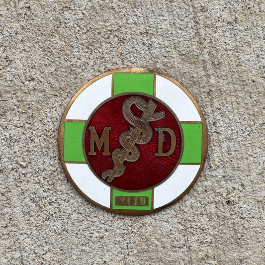 Photo of a 1925 MD Medical Doctor Porcelain Badge Emblem License Plate Topper Auto Tag Garage Decor Vintage Caduceus 2119 with original patina