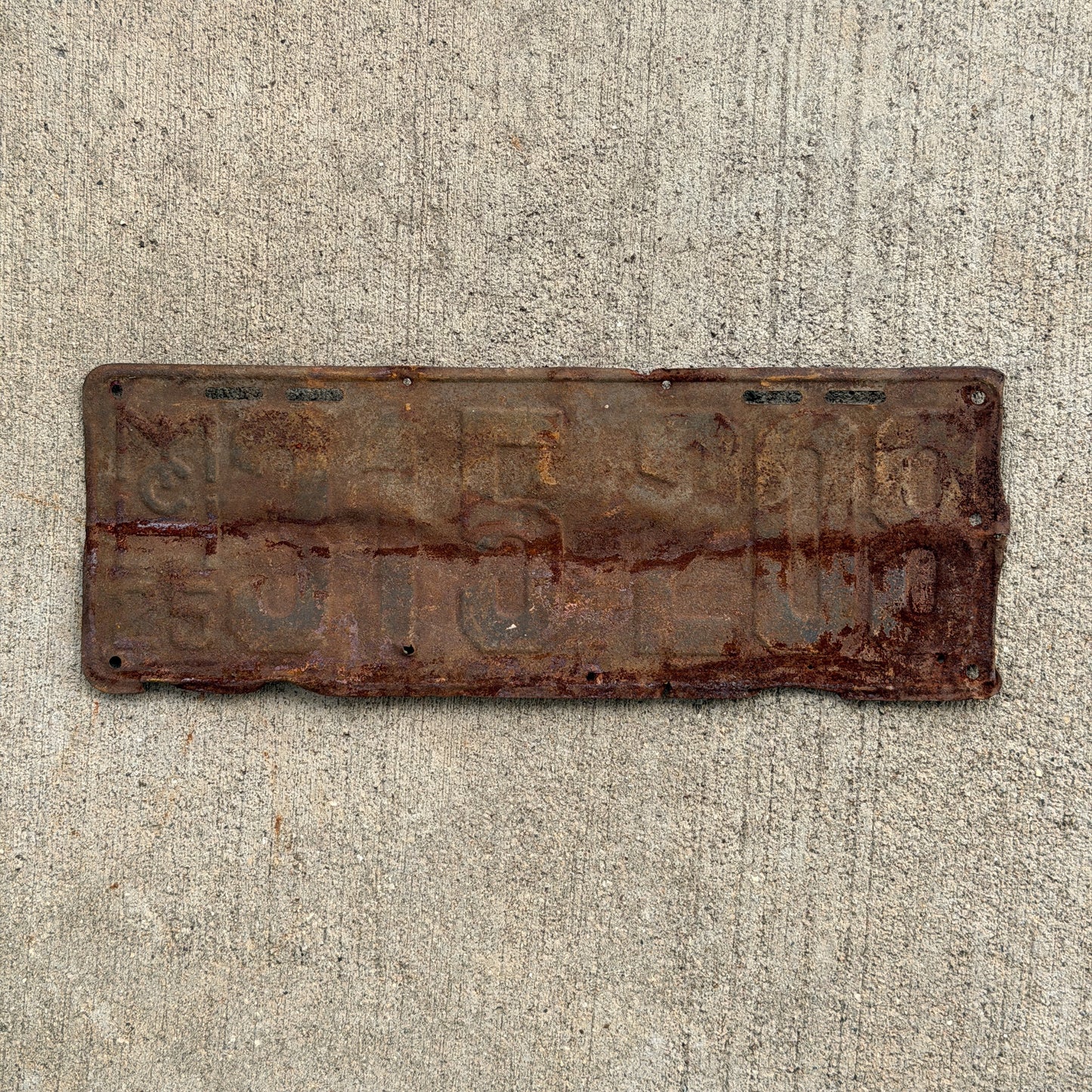 Photo of a 1925 Michigan License Plate Auto Tag Garage Decor Vintage 315 208 with original patina
