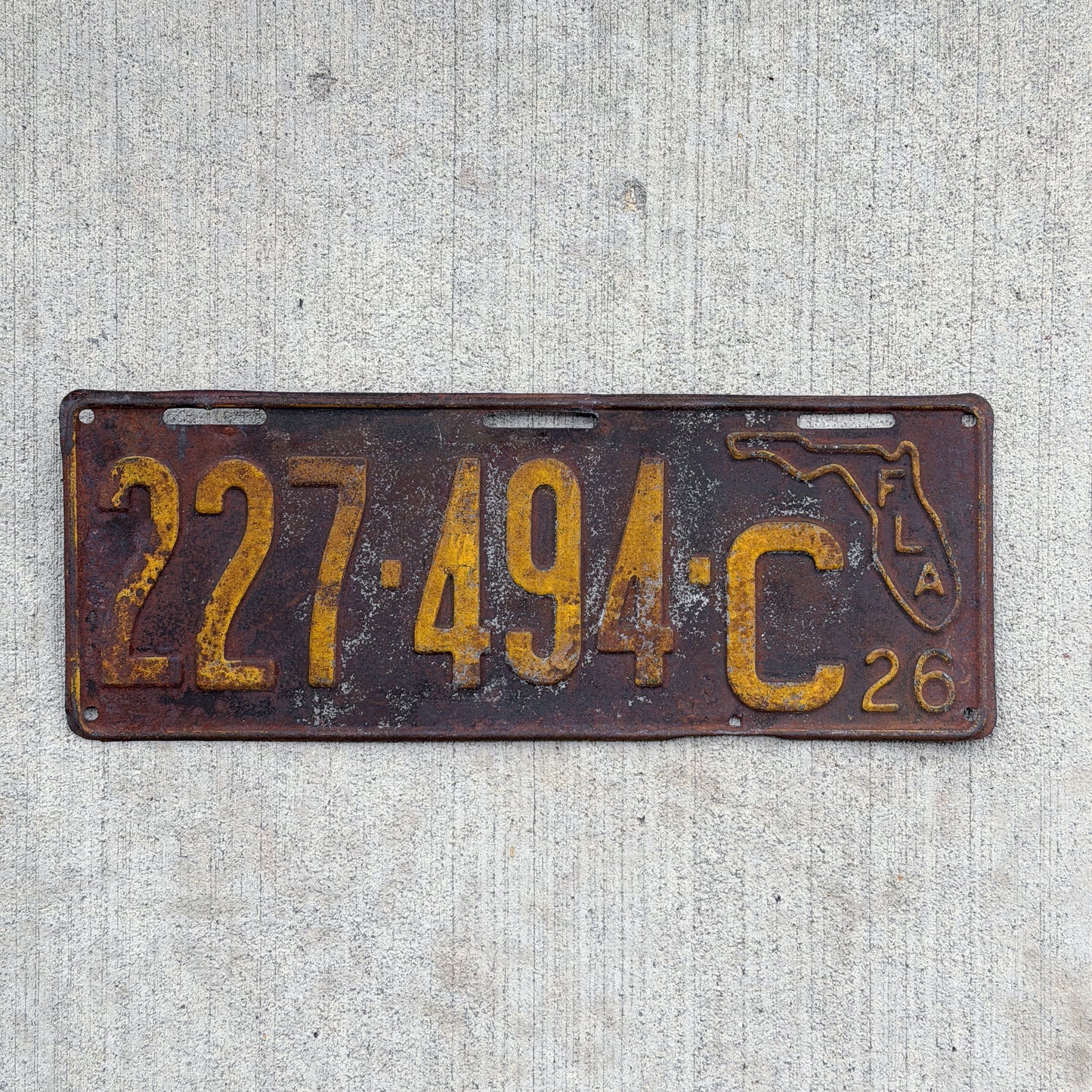 Photo of a 1926 Florida License Plate Auto Tag Garage Decor Vintage State Shape 227 494 C with original patina