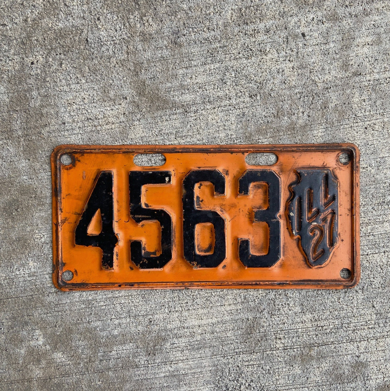 Photo of a 1927 Illinois License Plate Auto Tag Garage Decor Vintage Low Number Four Digit Iconic State Shape 4563 with original patina