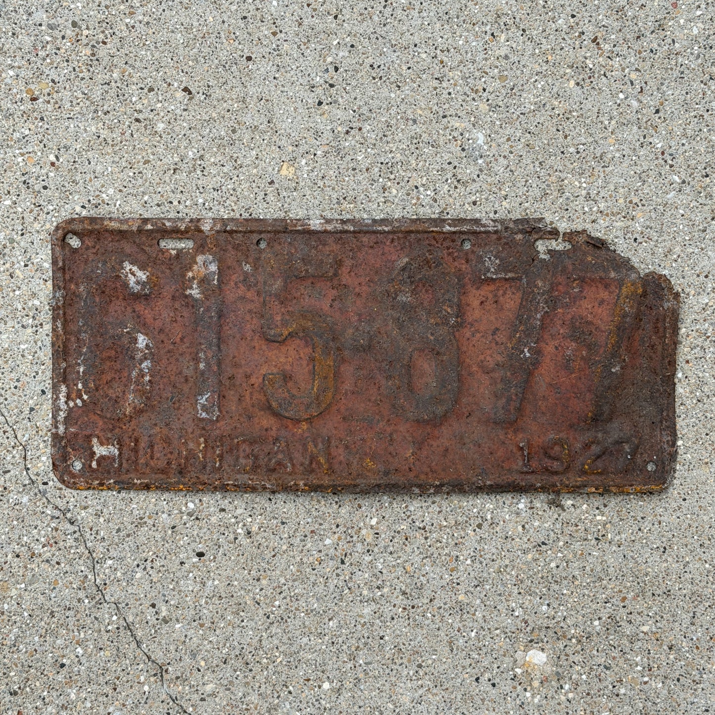 Photo of a 1927 Michigan License Plate Auto Tag Garage Decor Vintage 615 877 with original patina