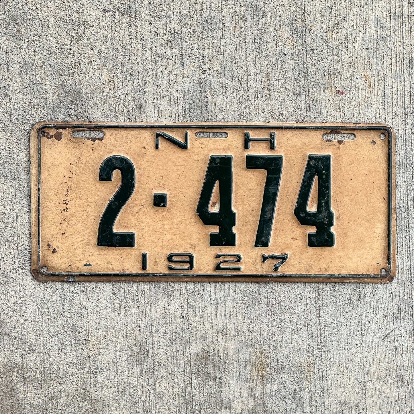 Photo of a 1927 New Hampshire License Plate Auto Tag Garage Decor Vintage Restamped 1925 Plate 2 474 with original patina