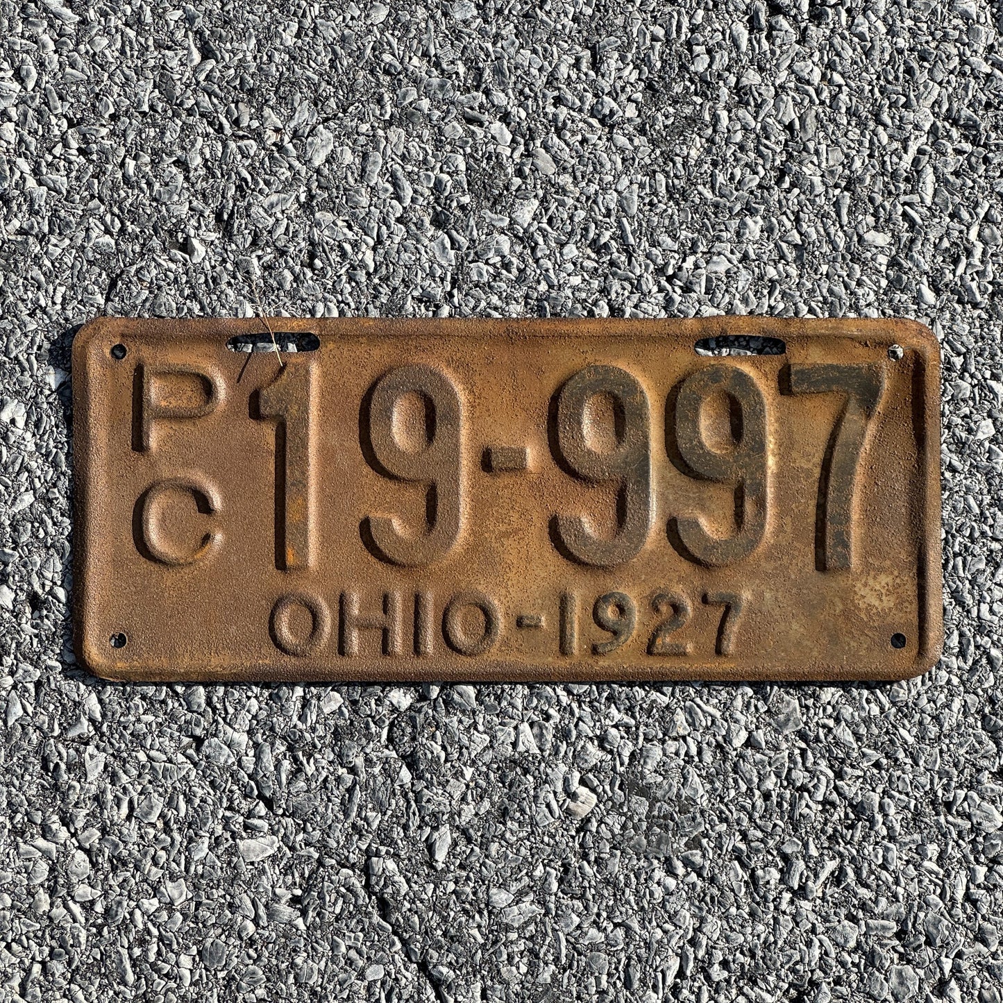 Photo of a 1927 Ohio Private Commercial License Plate Auto Tag Garage Decor Vintage Overflow Series B Prefix PC 19 997