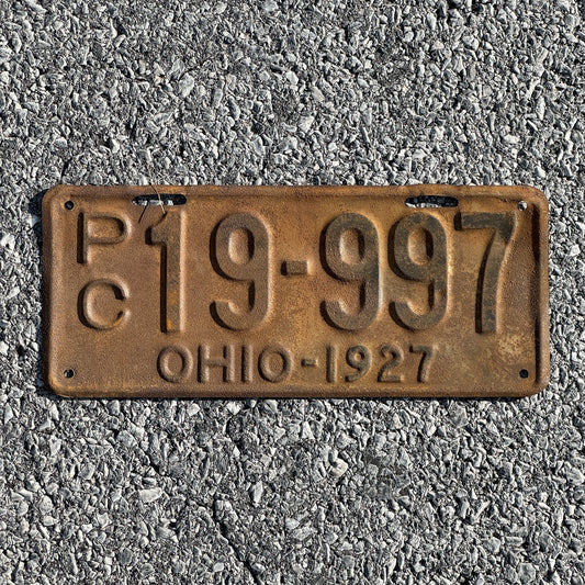 Photo of a 1927 Ohio Private Commercial License Plate Auto Tag Garage Decor Vintage Overflow Series B Prefix PC 19 997