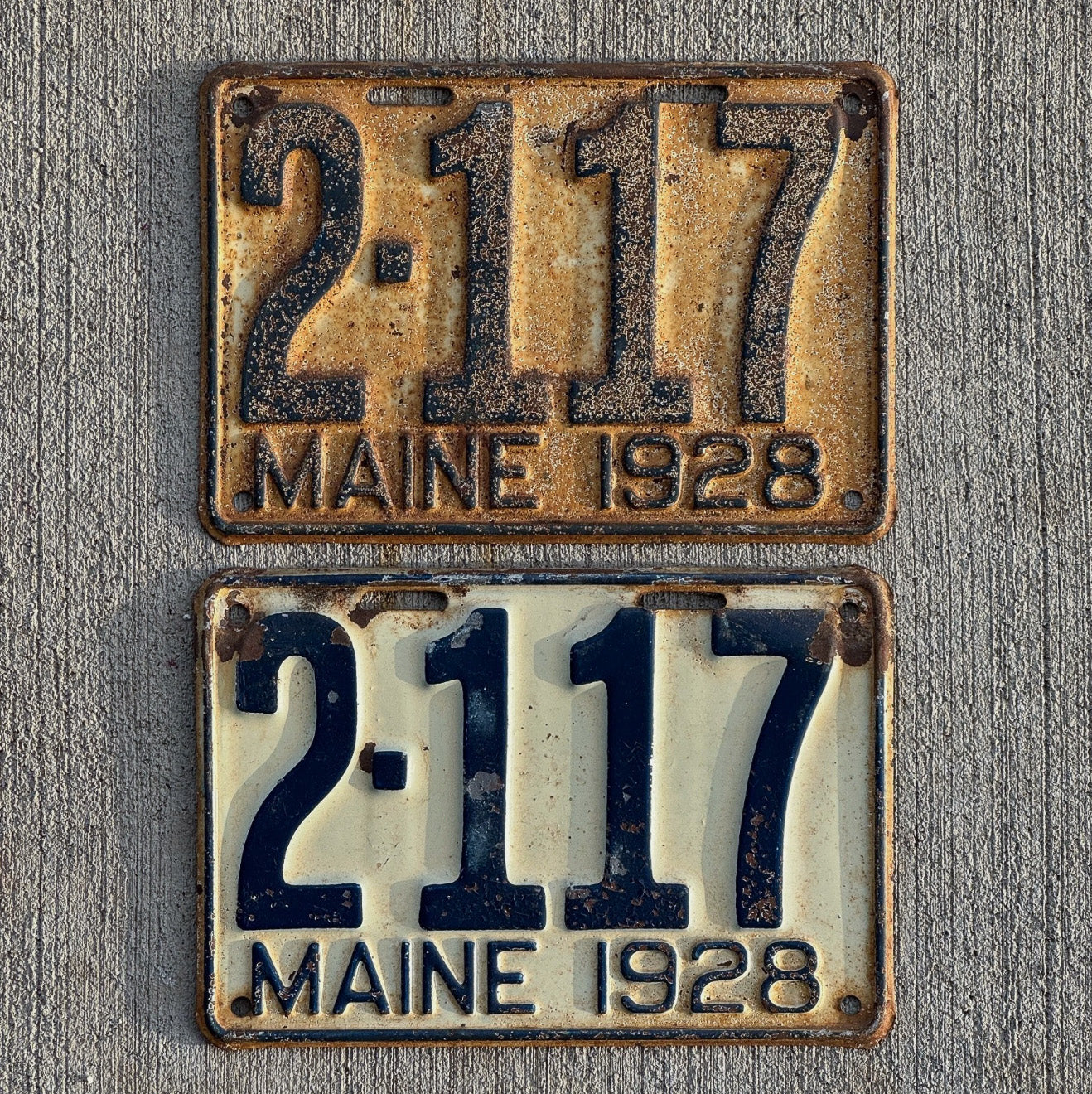 Photo of a 1928 Maine License Plate Auto Tag Garage Decor Vintage Ford Model A Year Low Number Four Digit 2117 with original patina
