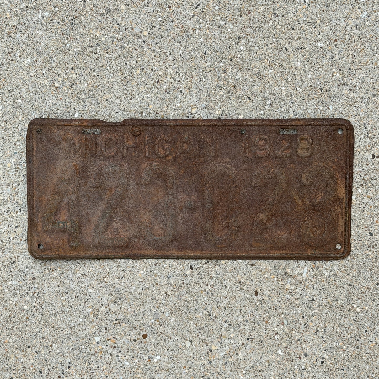 Photo of a 1928 Michigan License Plate Auto Tag Garage Decor Vintage Ford Model A Year 423 023 with original patina