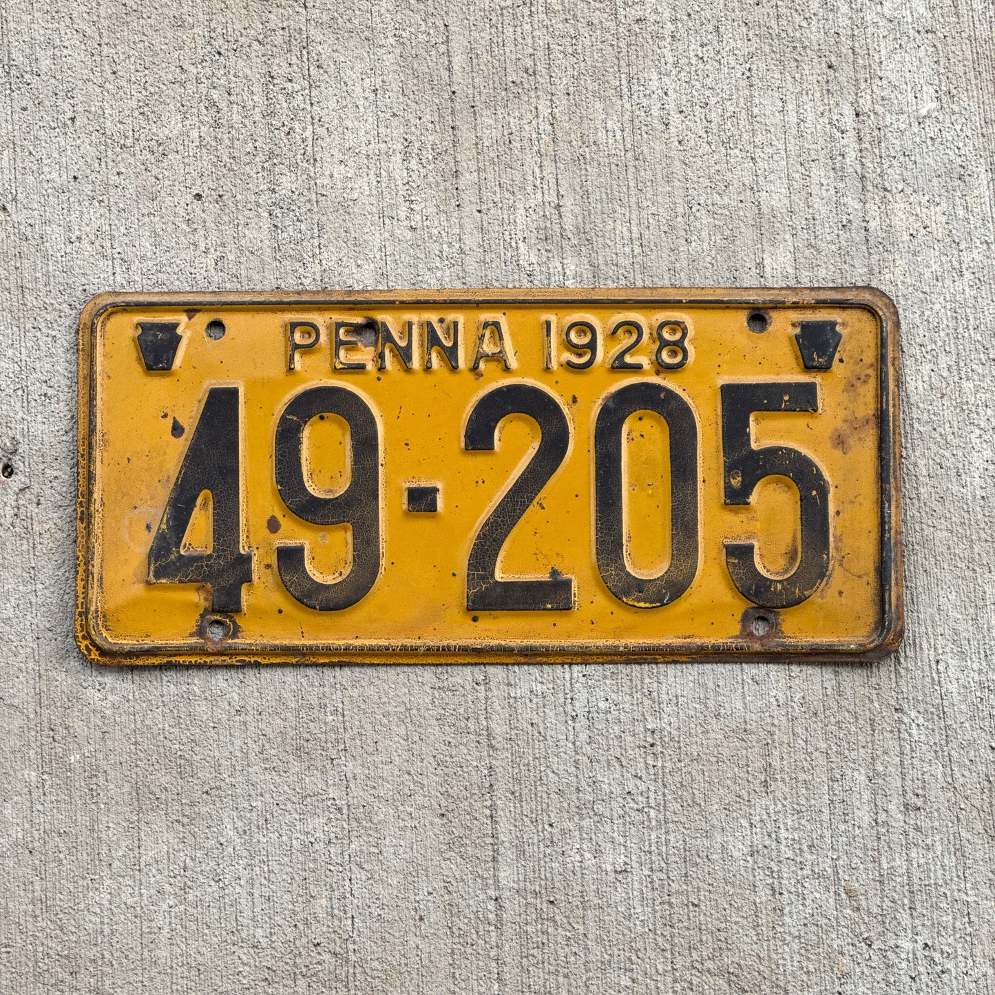 Photo of a 1928 Pennsylvania License Plate Auto Tag Garage Decor Vintage 49 205 with original patina