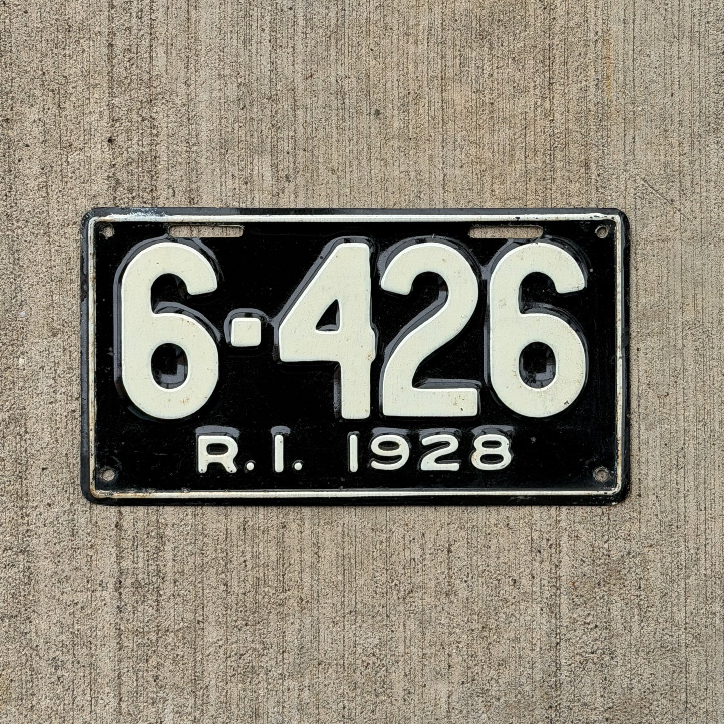Photo of a 1928 Rhode Island License Plate Auto Tag Garage Decor Vintage Low Number Four Digit 6426 with original patina