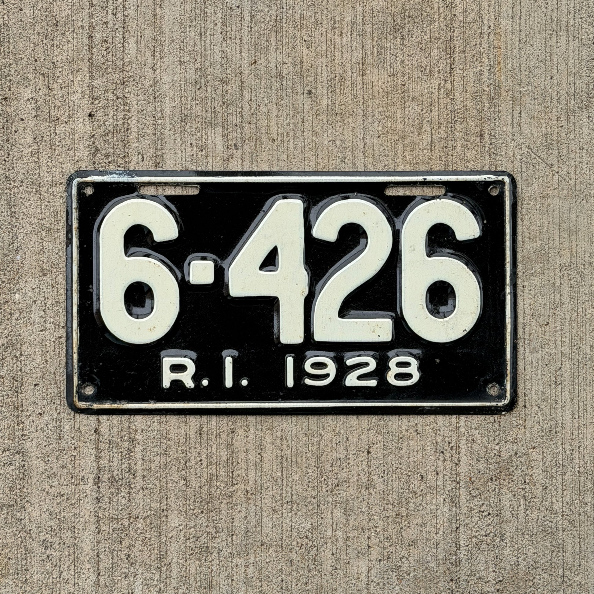 Photo of a 1928 Rhode Island License Plate Auto Tag Garage Decor Vintage Low Number Four Digit 6426 with original patina