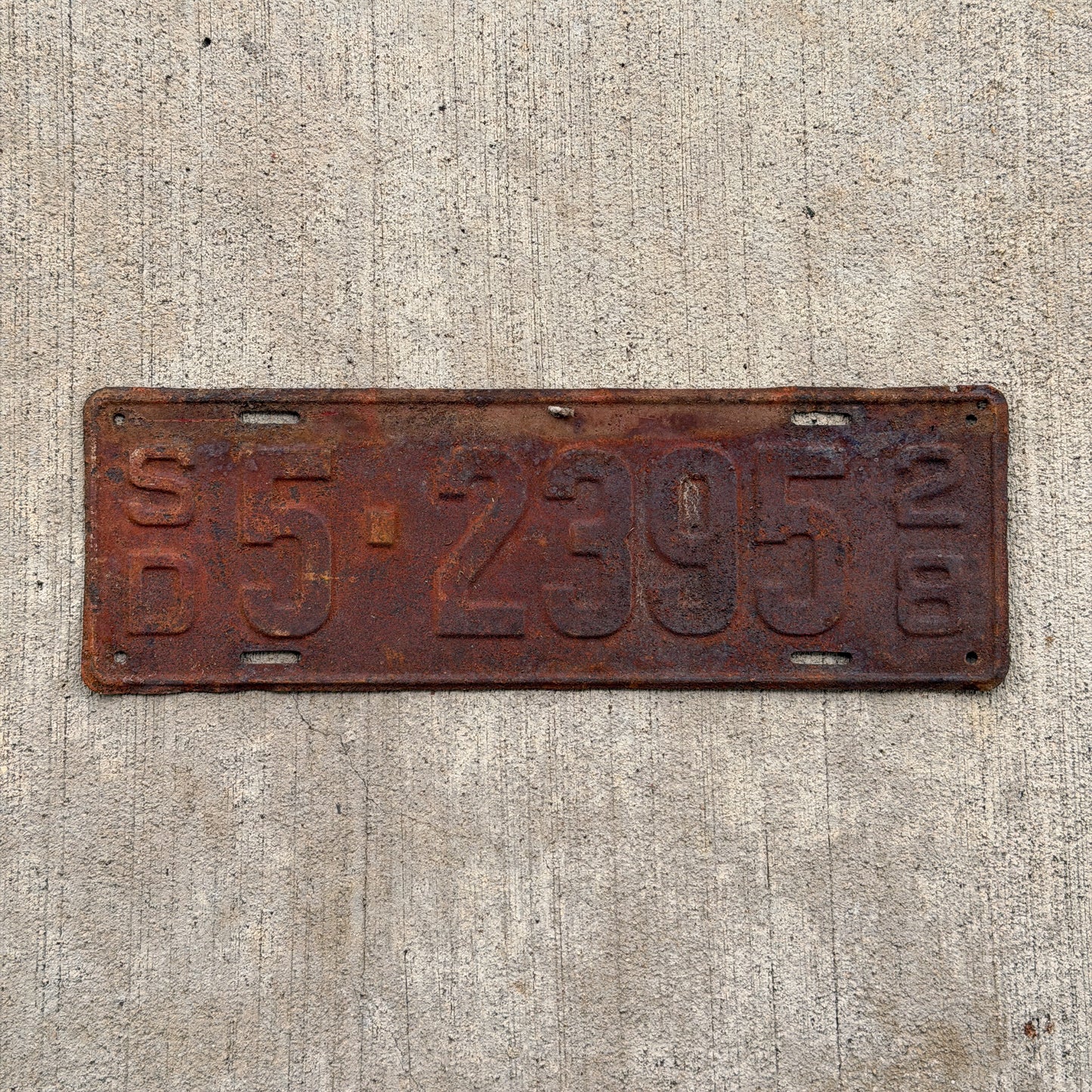 Photo of a 1928 South Dakota License Plate Auto Tag Garage Decor Vintage Ford Model A Year 5 2395 with original patina