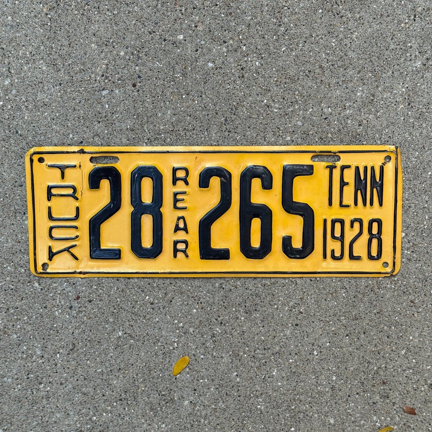 Photo of a 1928 Tennessee Truck License Plate Auto Tag Garage Decor Vintage Rear 28265