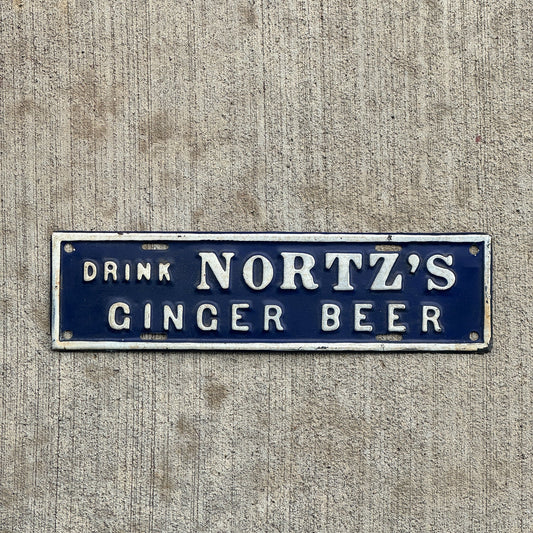 Photo of a 1930 Era License Plate Topper Auto Tag Garage Decor Vintage Drink Nortz's Ginger Beer with original patina