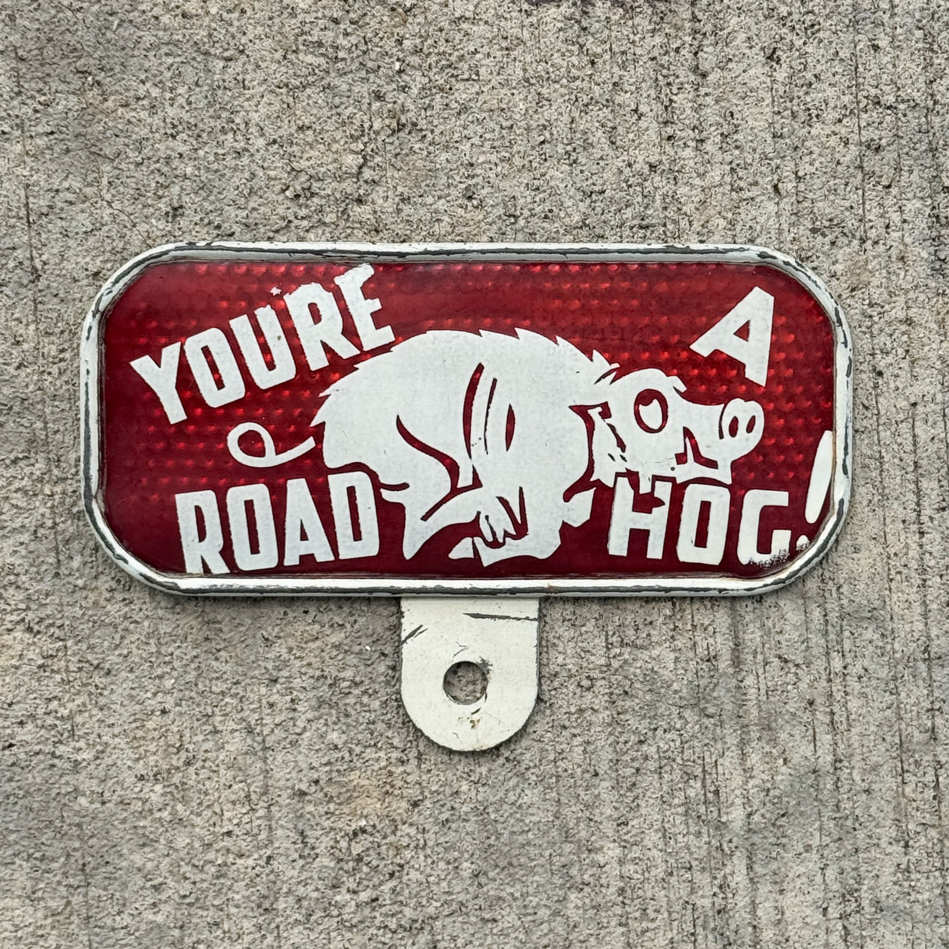 Photo of a 1930 Era You're A Road Hog License Plate Topper Auto Tag Garage Decor Vintage Snow Craggs with original patina