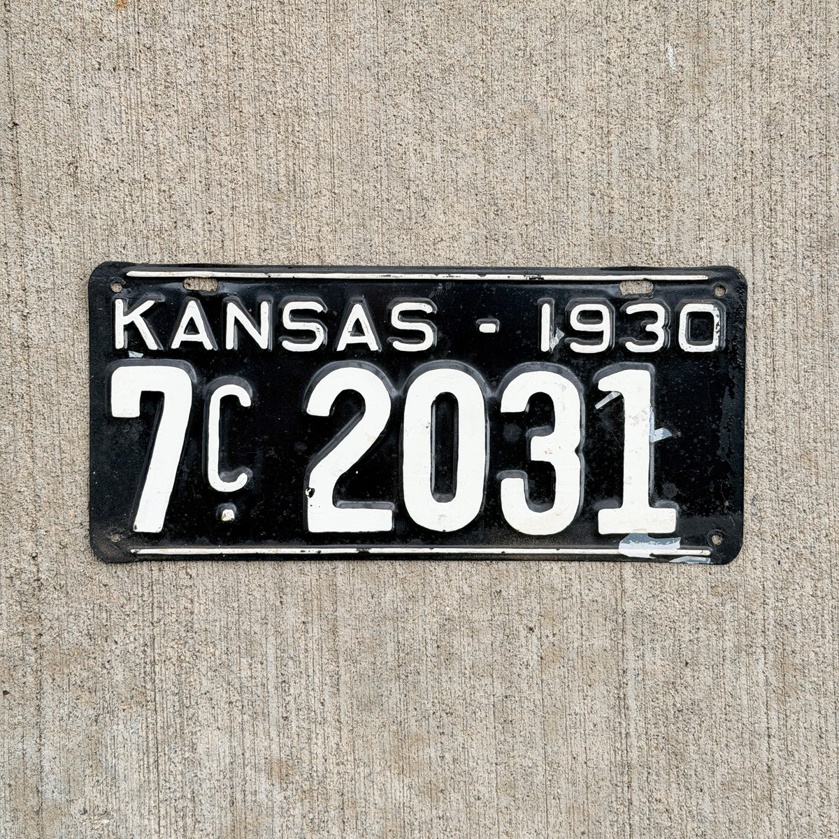 Photo of a 1930 Kansas License Plate Auto Tag Garage Decor Vintage Ford Model A Year 7 C 2031 with original patina