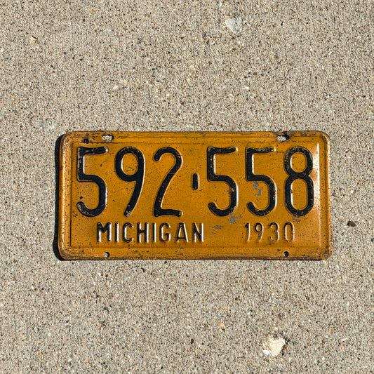 Photo of a 1930 Michigan License Plate Auto Tag Garage Decor Vintage Ford Model A Year 592 558 with original patina