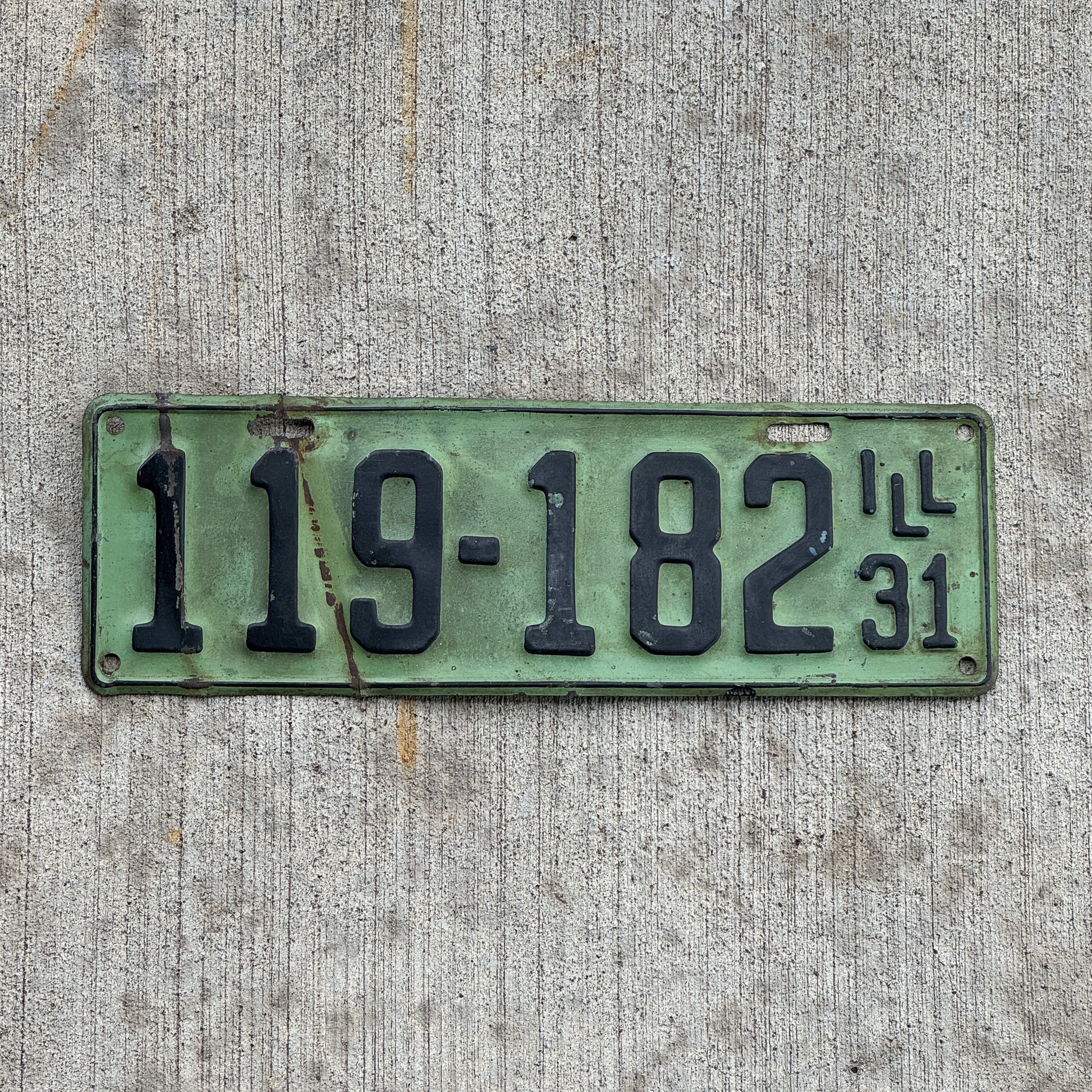 Photo of a 1931 Illinois License Plate Auto Tag Garage Decor Vintage Ford Model A Year 119 182 with original patina