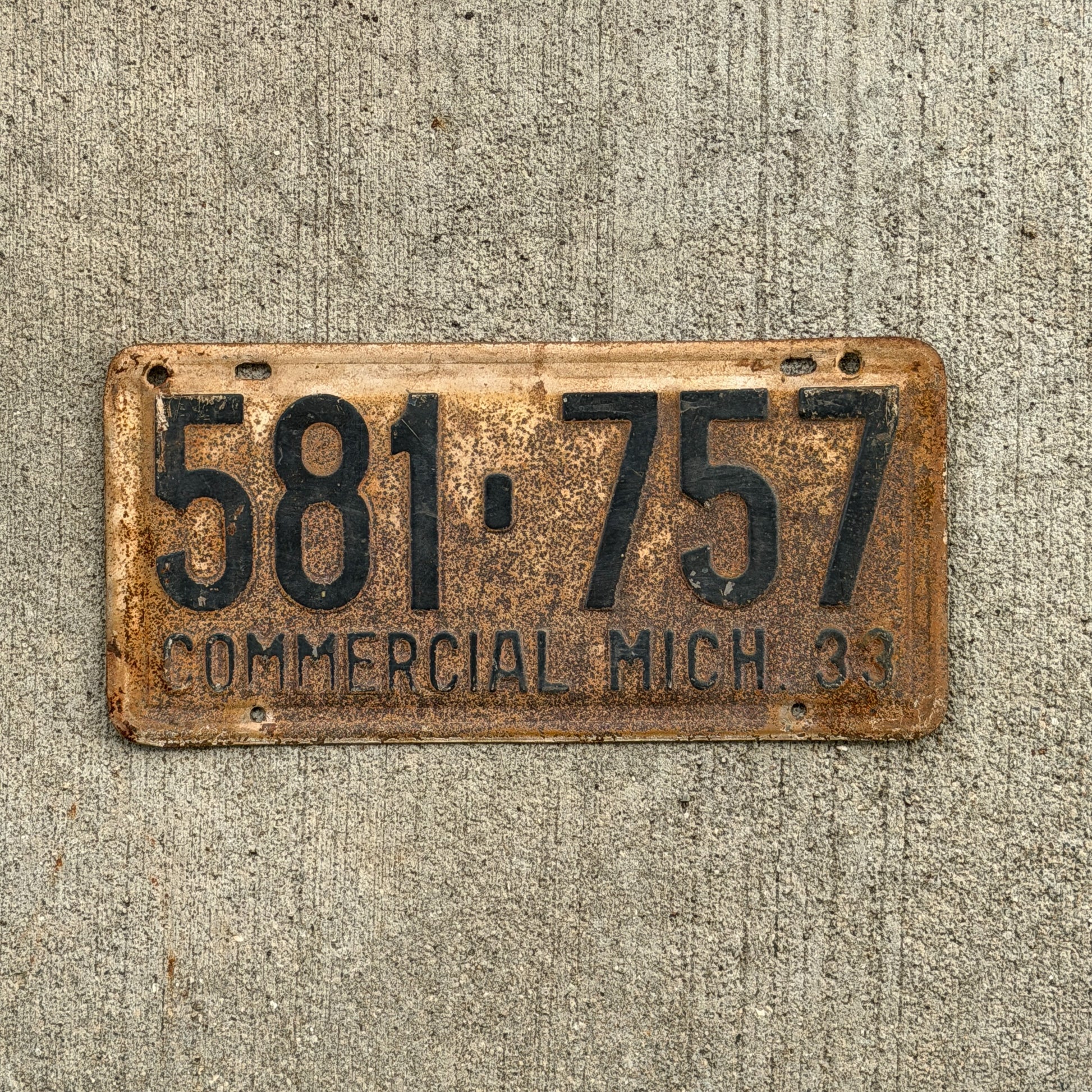 Photo of a 1933 Michigan Commercial License Plate Auto Tag Garage Decor Vintage 581 757 with original patina