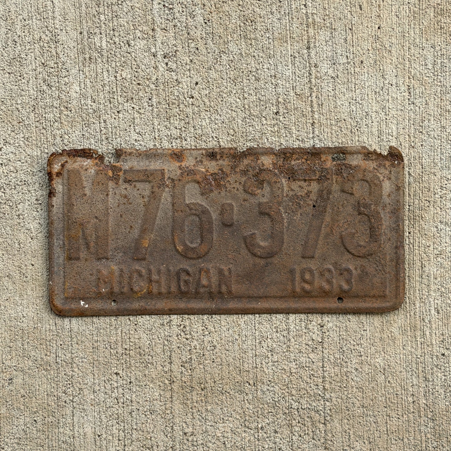 Photo of a 1933 Michigan License Plate Auto Tag Garage Decor Vintage M76 373 with original patina