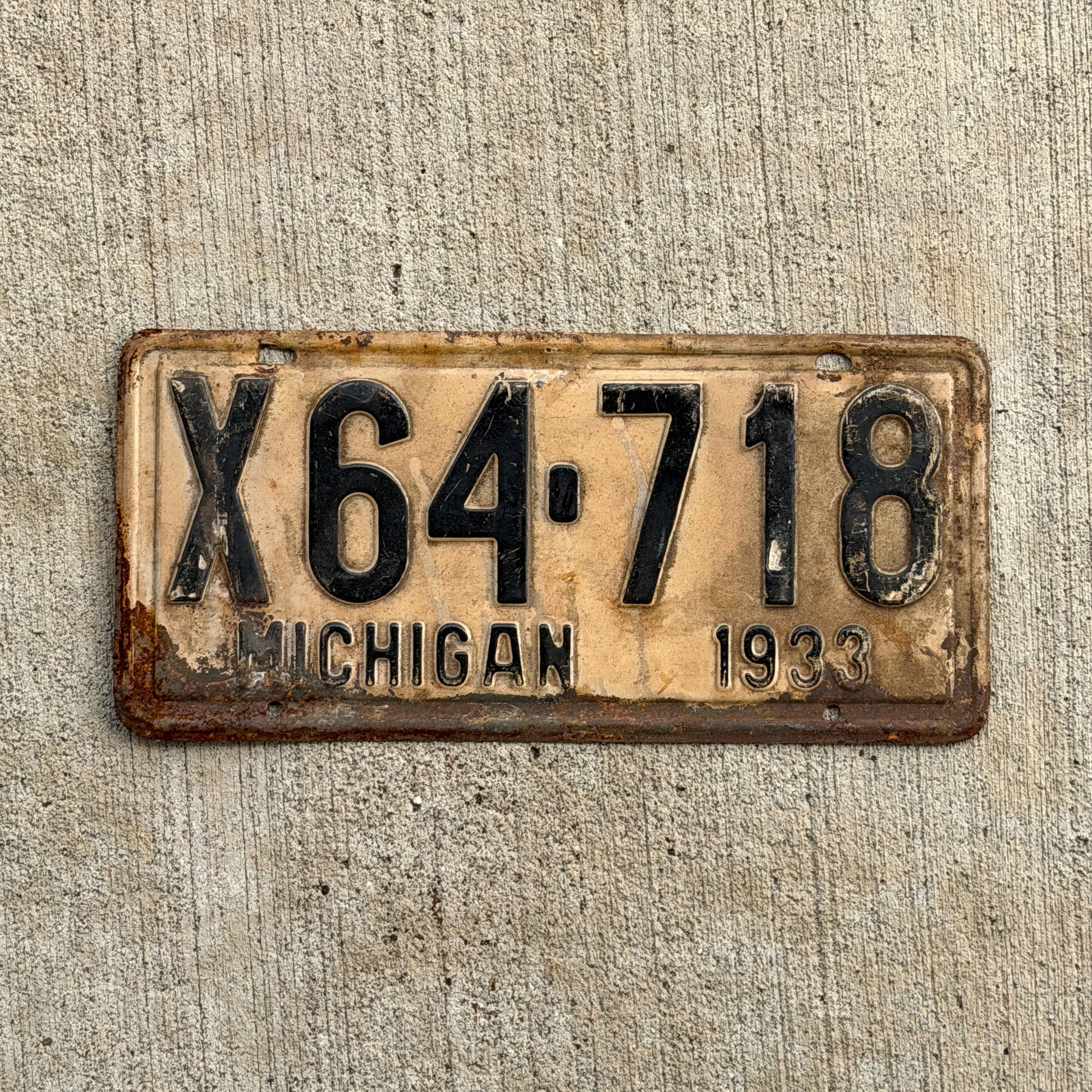 Photo of a 1933 Michigan License Plate Auto Tag Garage Decor Vintage X64 718 with original patina